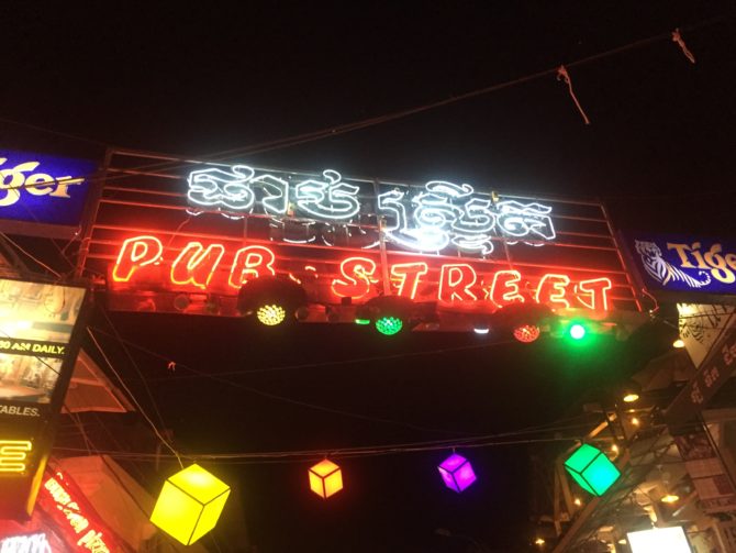 Illuminated pub street sign, in Siem Reap, Cambodia