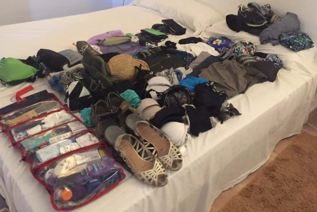 Long-term Travel Packing List Dilemmas, all items laid out on bed