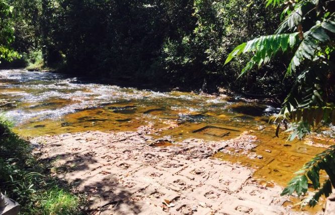 Kulen Mountain, Valley of a thousand Lingas, Phnom Kulen National Park, River flowing over carvings on sandstone river bed