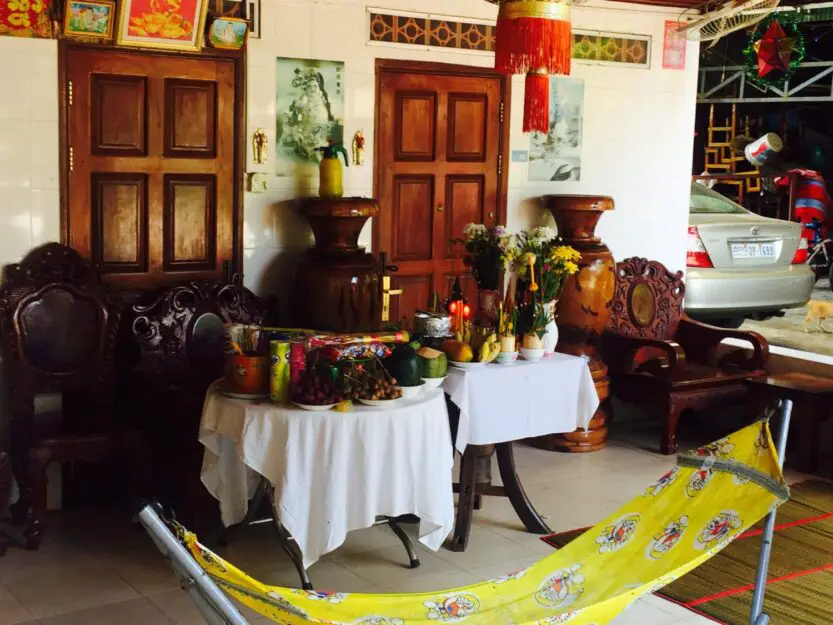 Khmer New Year offering, Siem Reap, Cambodia. Table of fruit, vegetables, incense and drinks