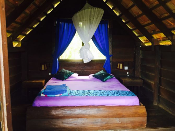 Inside of Bungalow at Nature Lodge in Mondulkiri. Double bed and mosquito net