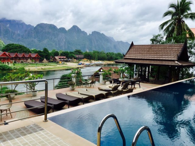 Infinity Pool at Silver Naga Hotel in Vang Vieng, Laos Infinity Pool View over the Nam Song River in the Silver Naga Hotel in Vang Vieng, Laos