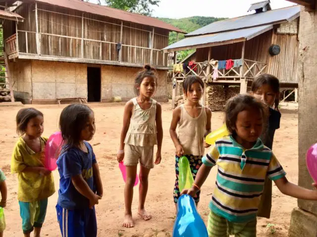 Kids with balloons in Nalan Neua Village in Nam Ha NPA, Laos