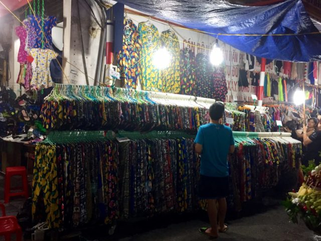 Brightly coloured, tropical fruit print clothes in Hanoi, Vietnam