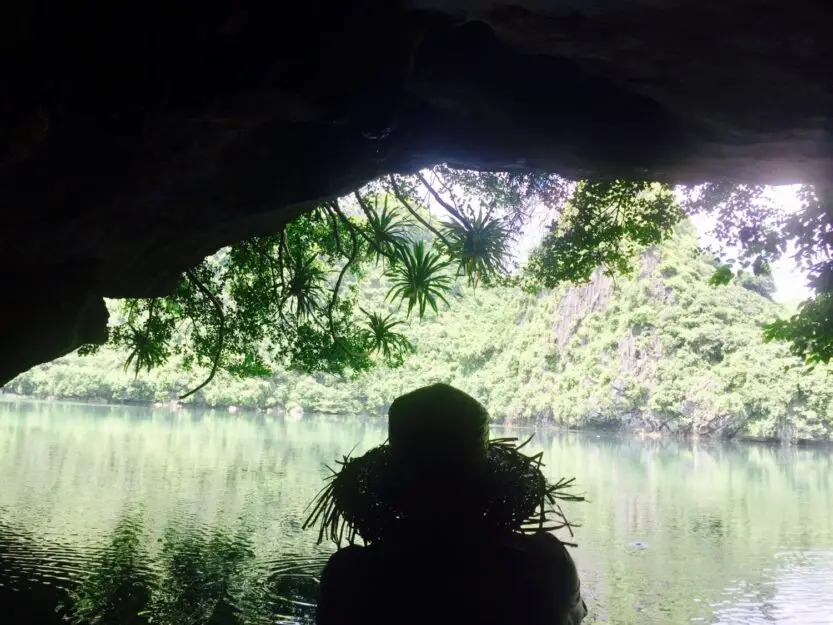 Dark Cave and its Lagoon in Bai Tu Long Bay, Vietnam