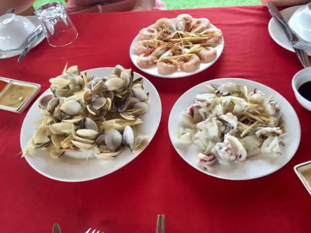 Lunch on Cat Ba Ventures Tour in Halong Bay, Vietnam. Squid, Clams, and Prawns