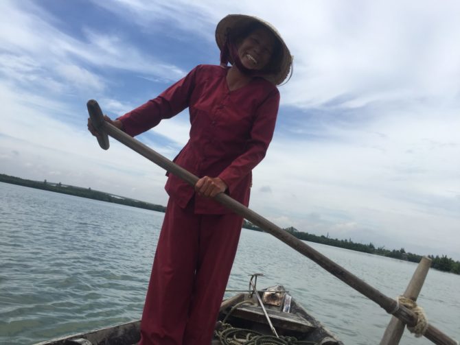 Vietnamese Fisherwomen Steering a Boat in Hoi An, Vietnam