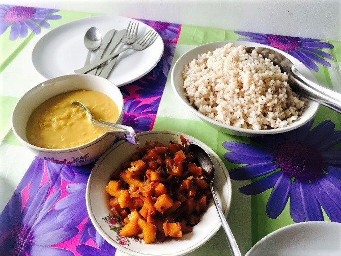 Bowls of Rice, Curry and Lentil Dal Bowls of rice, curry and lentil dahl.