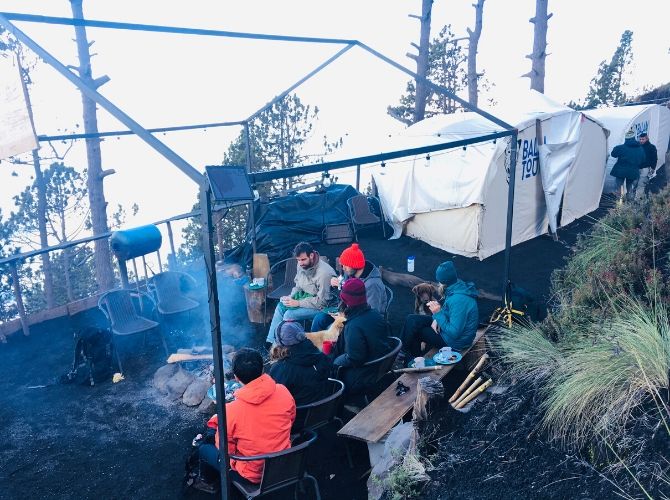 Balam Tours Acatenango Base Camp - hikers around the campfire near tents