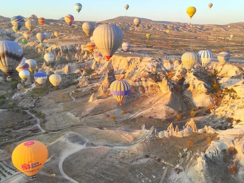 Hot air balloons floating amongst the fairy chimneys in Cappadocia