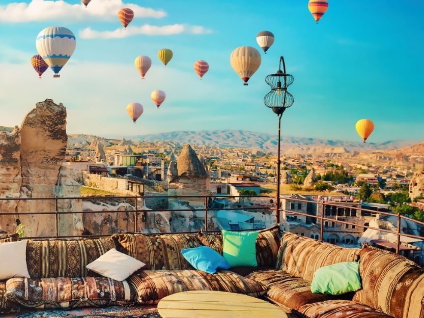 Rooftop terrace hot air balloons view in cappadocia