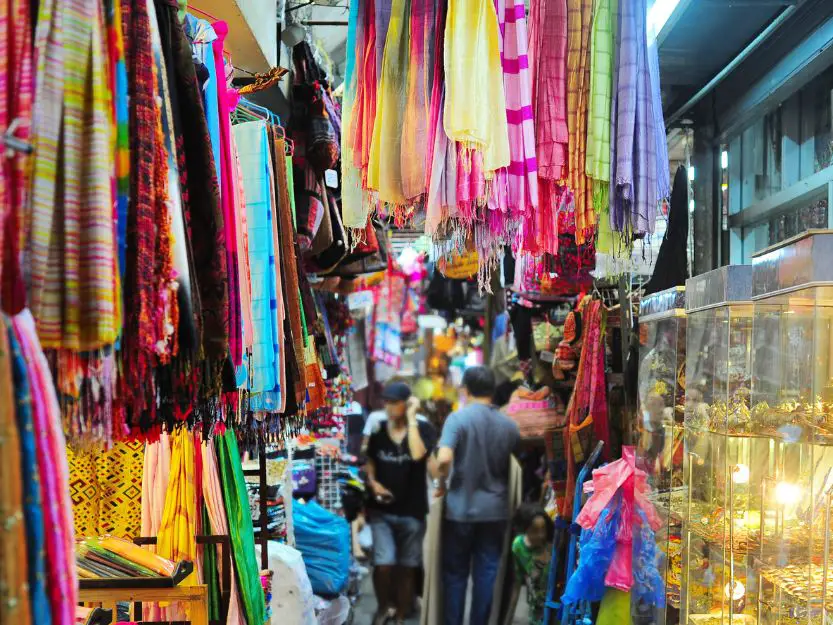 Colourful scarves and gold in Chatuchak Market in Bangkok, Thailand