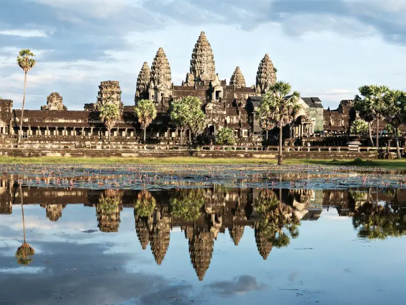 Image of Angkor Wat and reflection on water.
