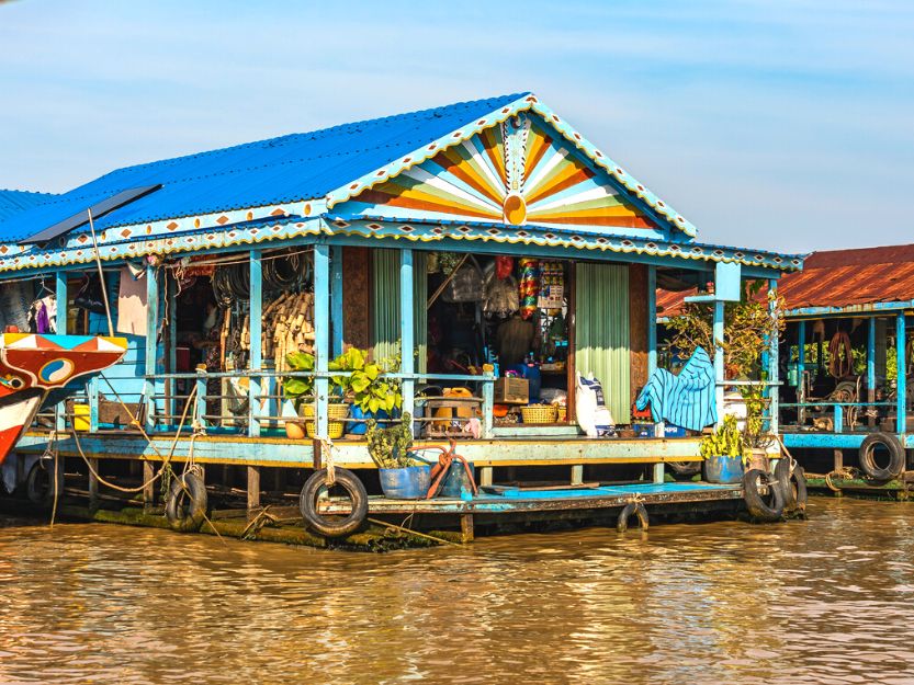 Floating Village on Tonle Sap Lake in Cambodia Colourful floating shop on Tonle Sap lake in Cambodia