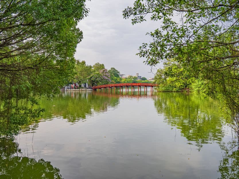 Hoan Kiem Lake in Hanoi, Vietnam Red bridge over green water of Hoan Kiem Lake in Hanoi, Vietnam.