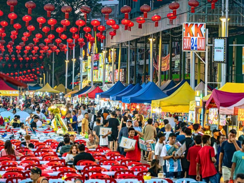 Jalan Alor in Kuala Lumpur Jalan Alor in Kuala Lumpur with street food stalls with tables and red chairs down the centre
