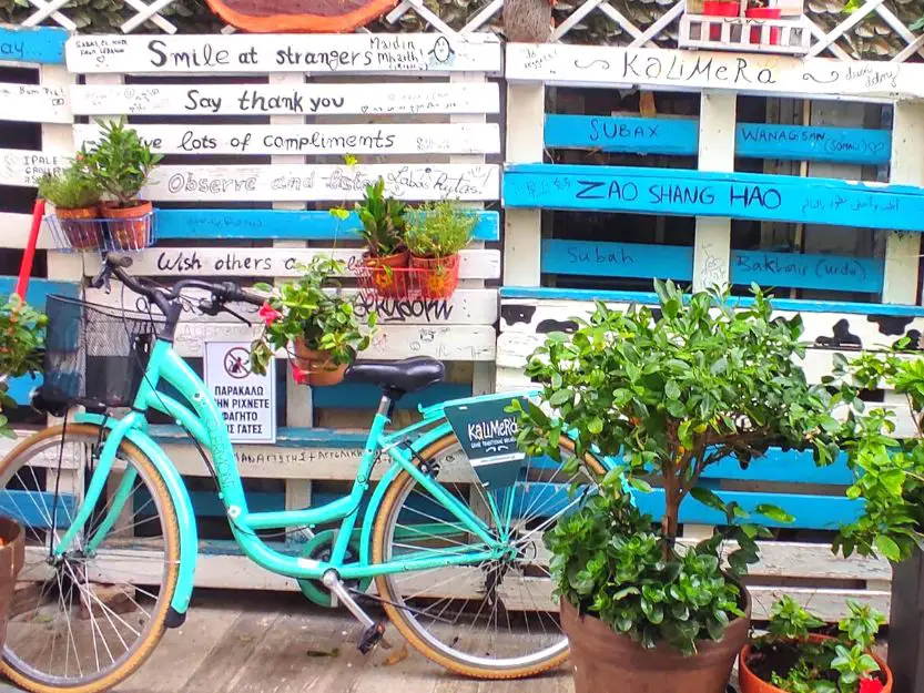 Colourful greetings display with bicycle outside Kalimera breakfast and brunch restaurant in Nafplio, Greece