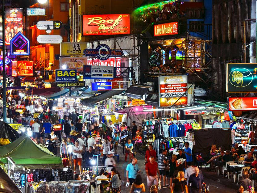 Neon signs on a busy Khaosan Road in Bangkok, Thailand