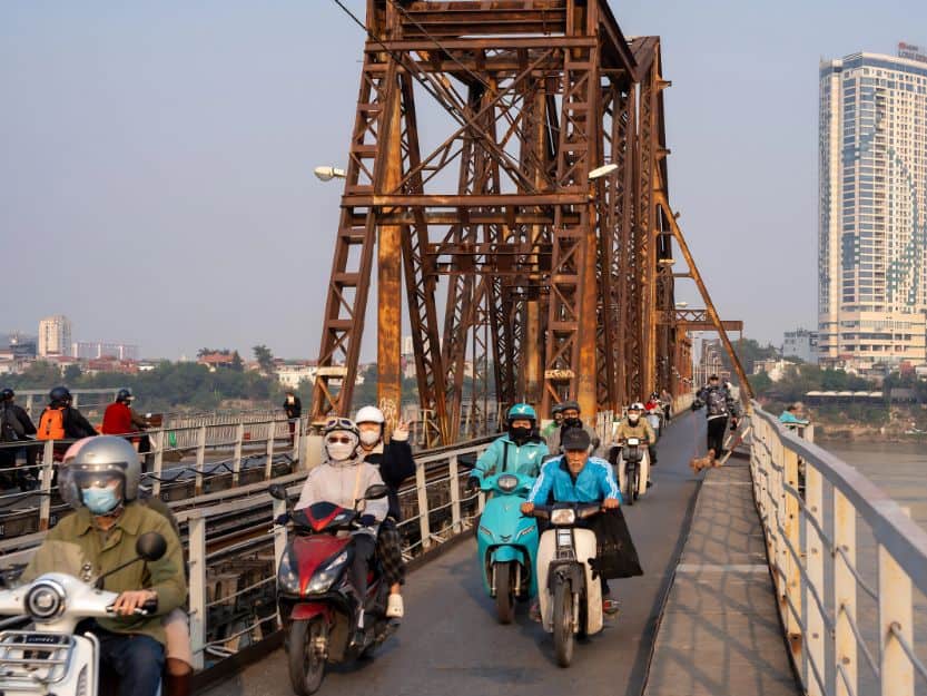 Long Bien Bridge in Hanoi Local motorcyclists on Long Bien Bridge in Hanoi