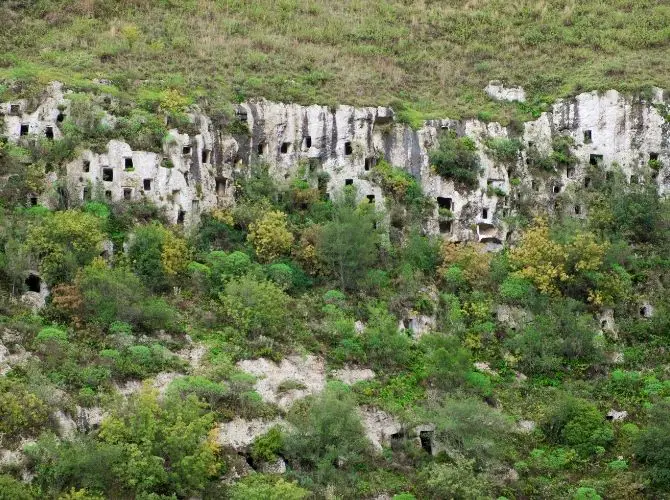 Necropoli di Pantalica, bronze age tombs carved in limestone valley  in Pantalica Nature Reserve