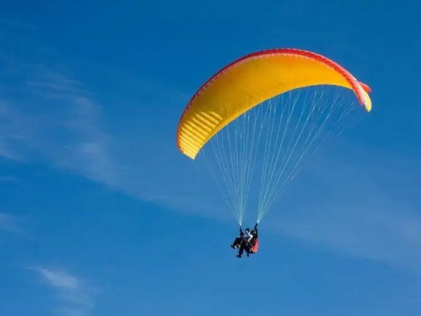 Yellow and red, paragliding chute in Chania, Crete