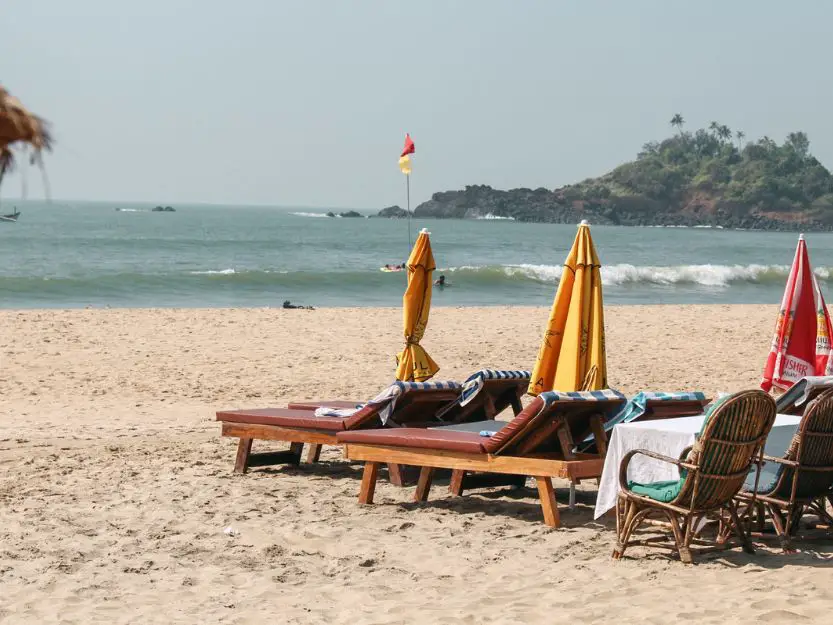 Patnem Beach in South Goa. Sunbeds and parasols on the beach.