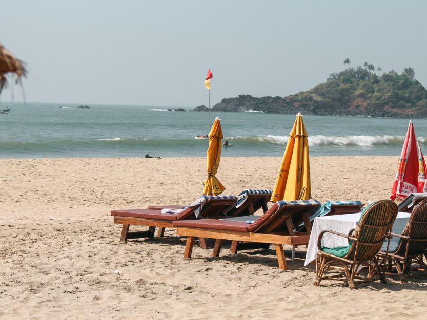 Patnem Beach in South Goa. Sunbeds and parasols on the beach.