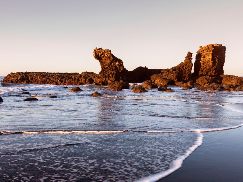 Pig Rock at Playa El Tunco, a rock shaped like a pig laying on it's back in the sea.