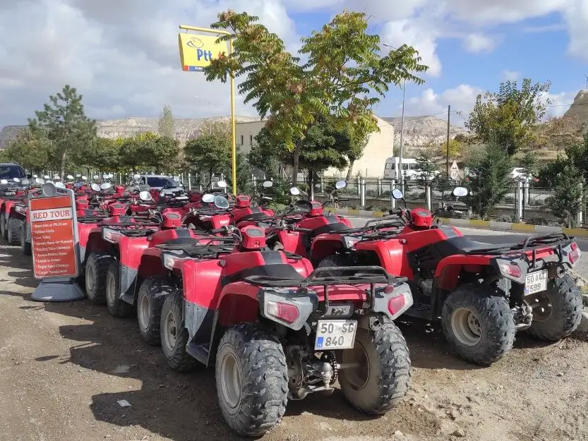 Red quad bikes lined up in Cappadocia