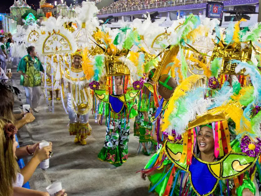 Rio Carnaval in Brazil, image of women dancing in colourful elaborate costumes.