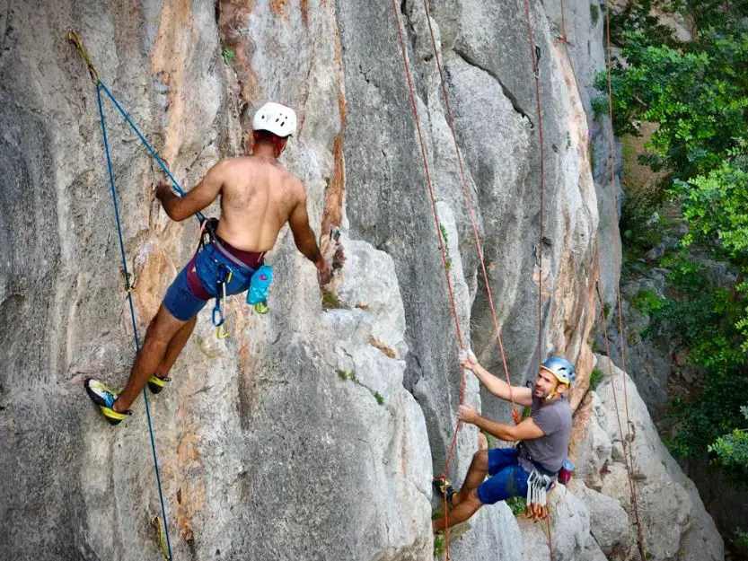 Two men rock climbing on Katafyki Crag near Ermioni in Greece.