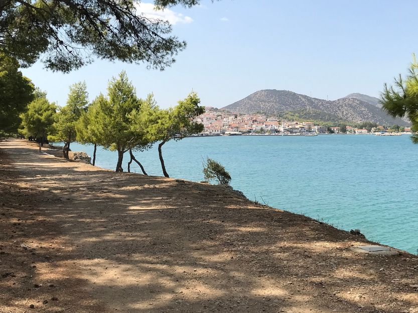 The pine tree lined Bisti of Ermioni with the sea and Limani side in the background