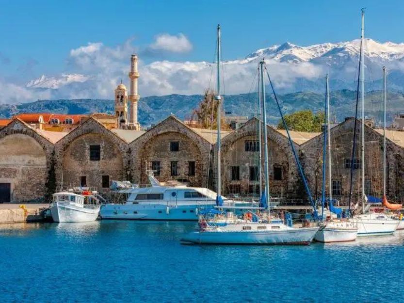 Venetian Arsenals in Chania, Crete. Boats in the foreground